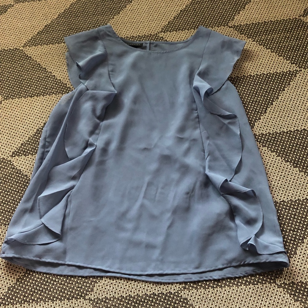 Woman’s blue shirt